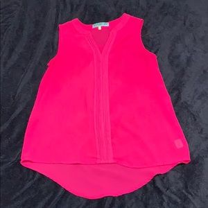 Bright pink sleeveless blouse